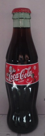 2000-1070 € 5,00 coca cola Kerstflesje kerstman met 1 kind